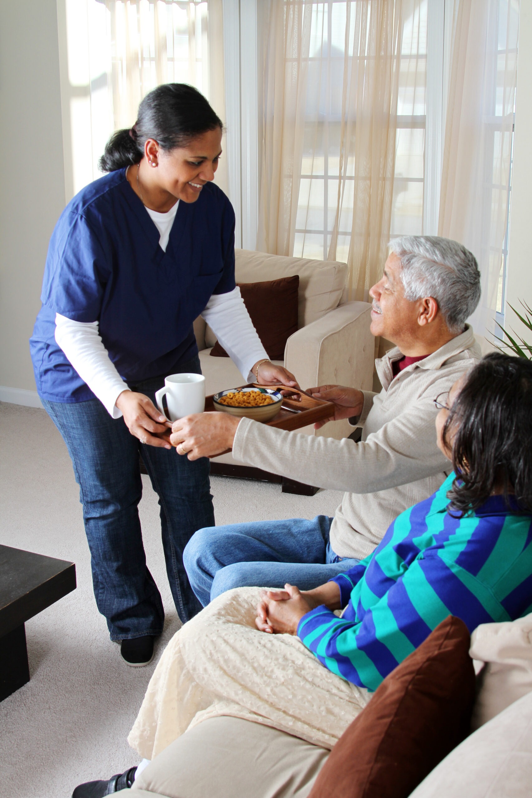 Home health care worker and an elderly couple